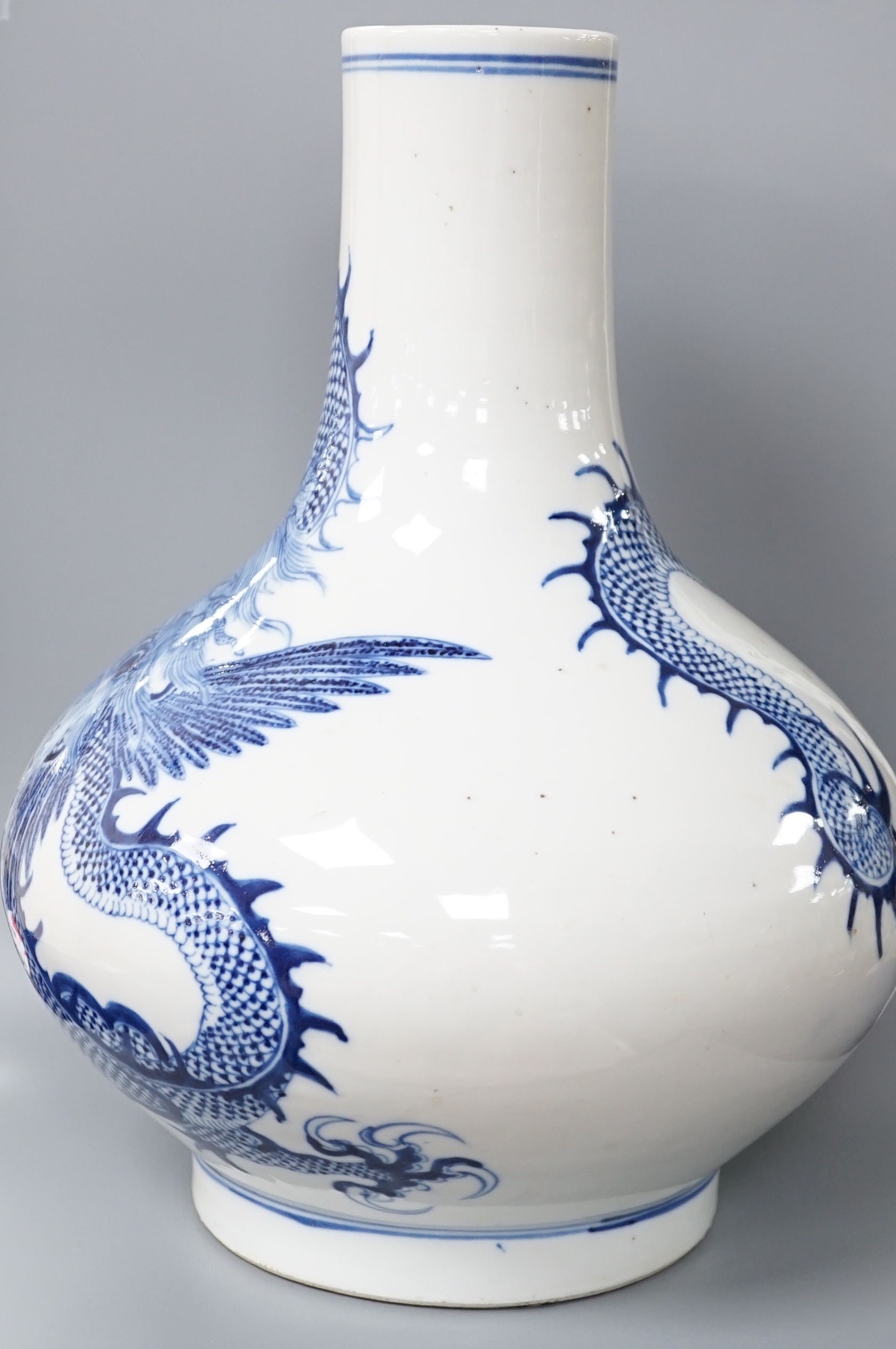 A Chinese blue and white ‘dragon’ bottle vase 32cm